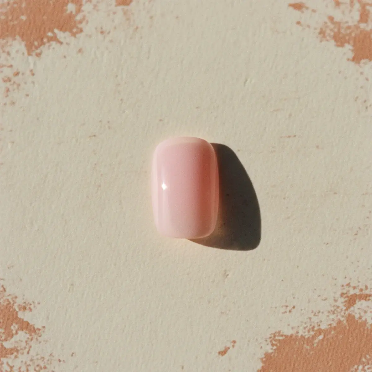 A flat-lay of various back-to-college nail-polish bottles in soft beige, pink, sage, burgundy, and gold tones beside an open notebook, a fountain pen, and a small bouquet of dried flowers