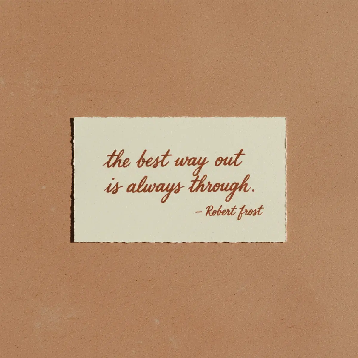 A vintage typewriter on a sunlit desk with paper showing a single typed inspirational sentence beside a cup of black coffee