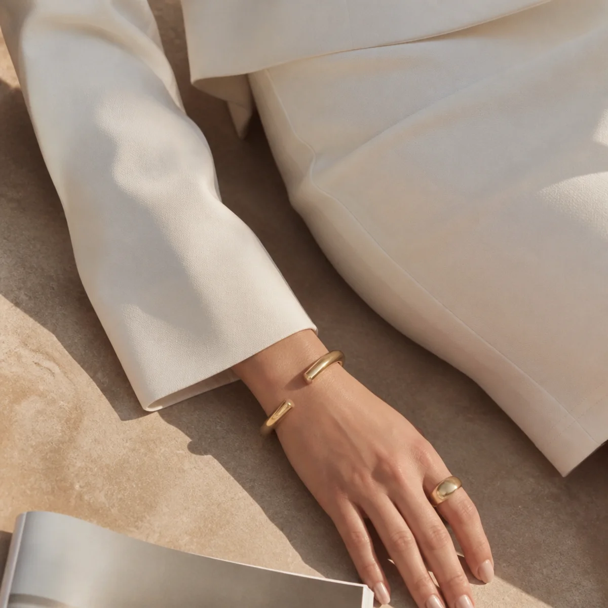 Faceless full-length shot of an all-white outfit with a white skirt and a white blazer