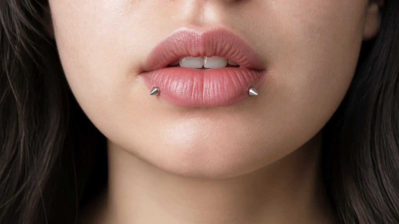 Angel fangs with implant-grade titanium studs