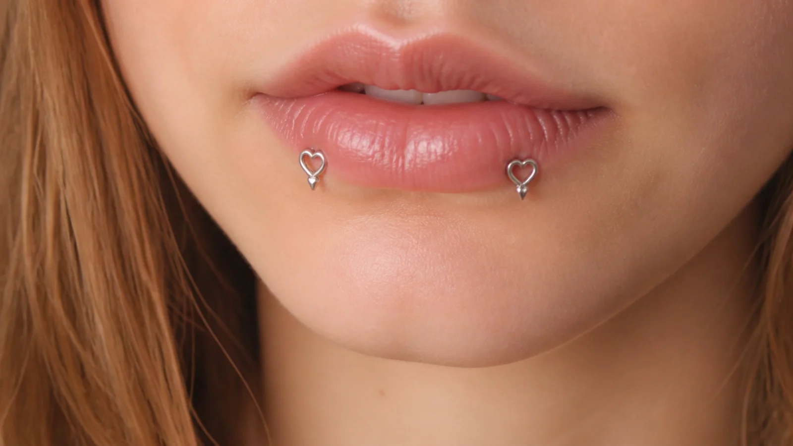 Angel fangs with sweet heart-shaped ends