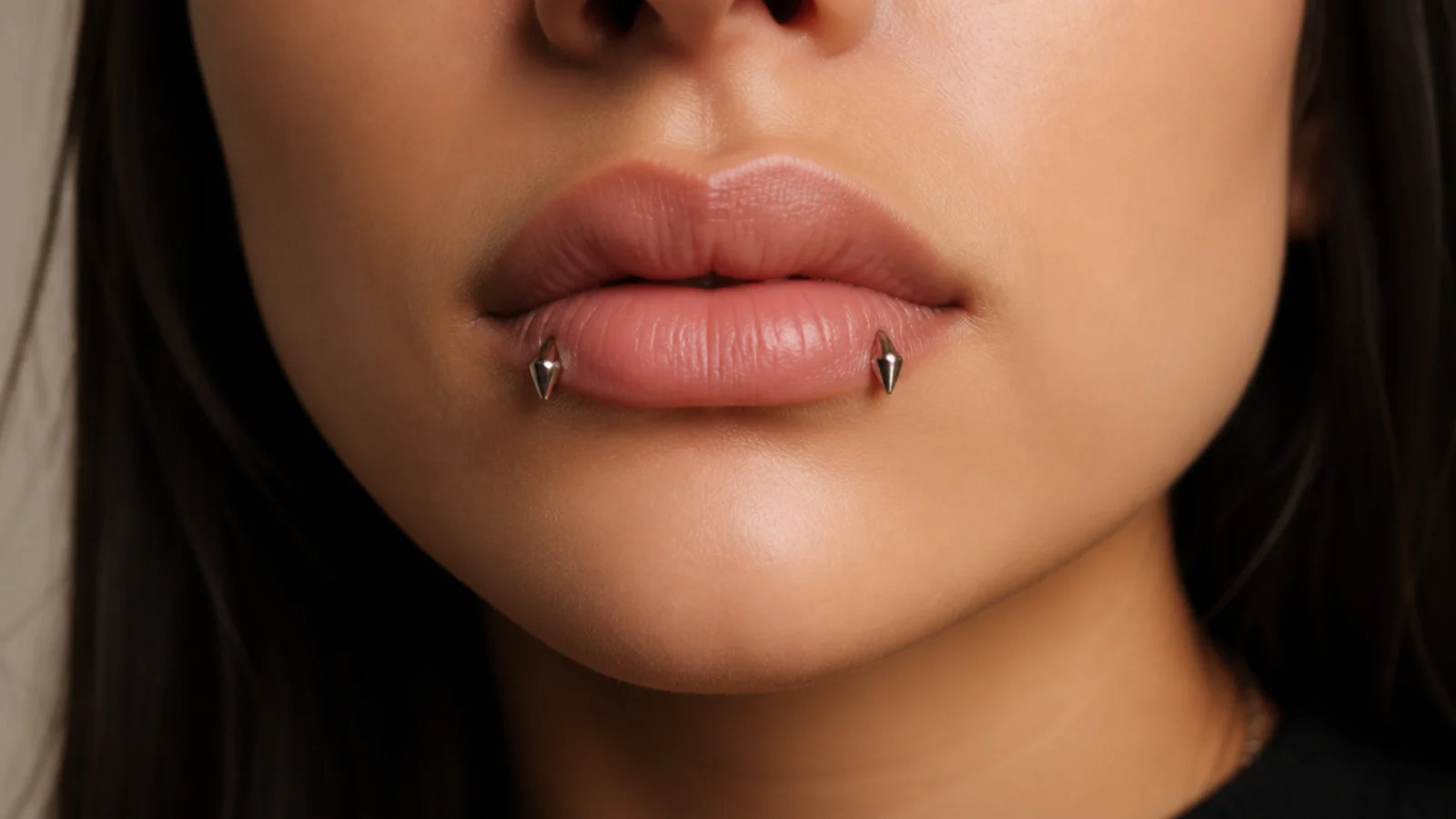 Angel fangs as part of a curated piercing collection