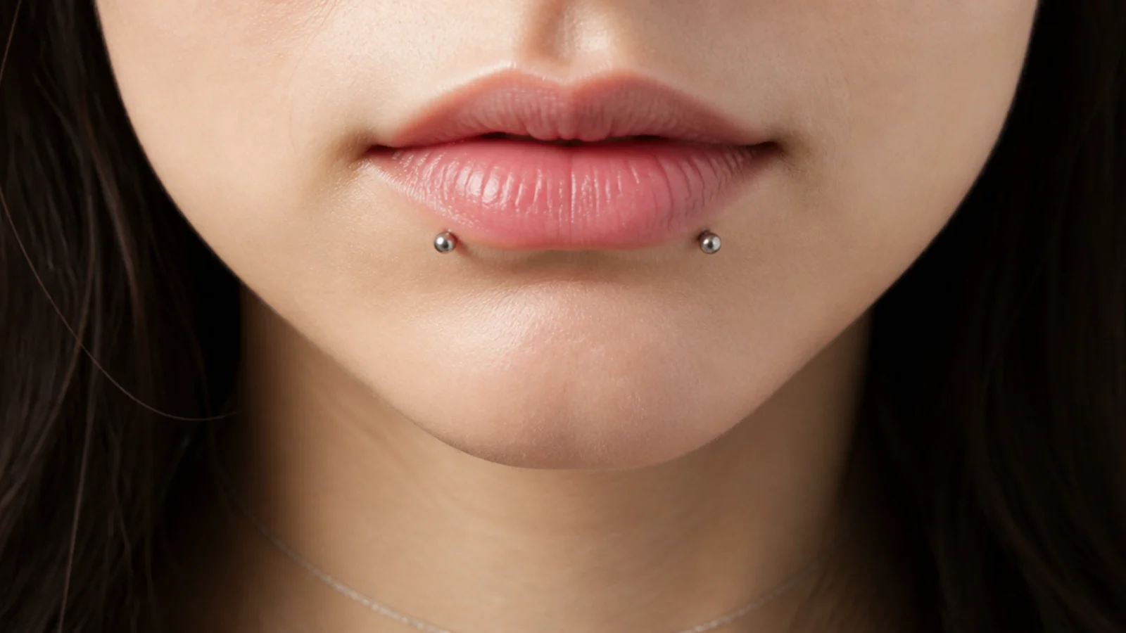 A piercer consultation before an angel fangs piercing