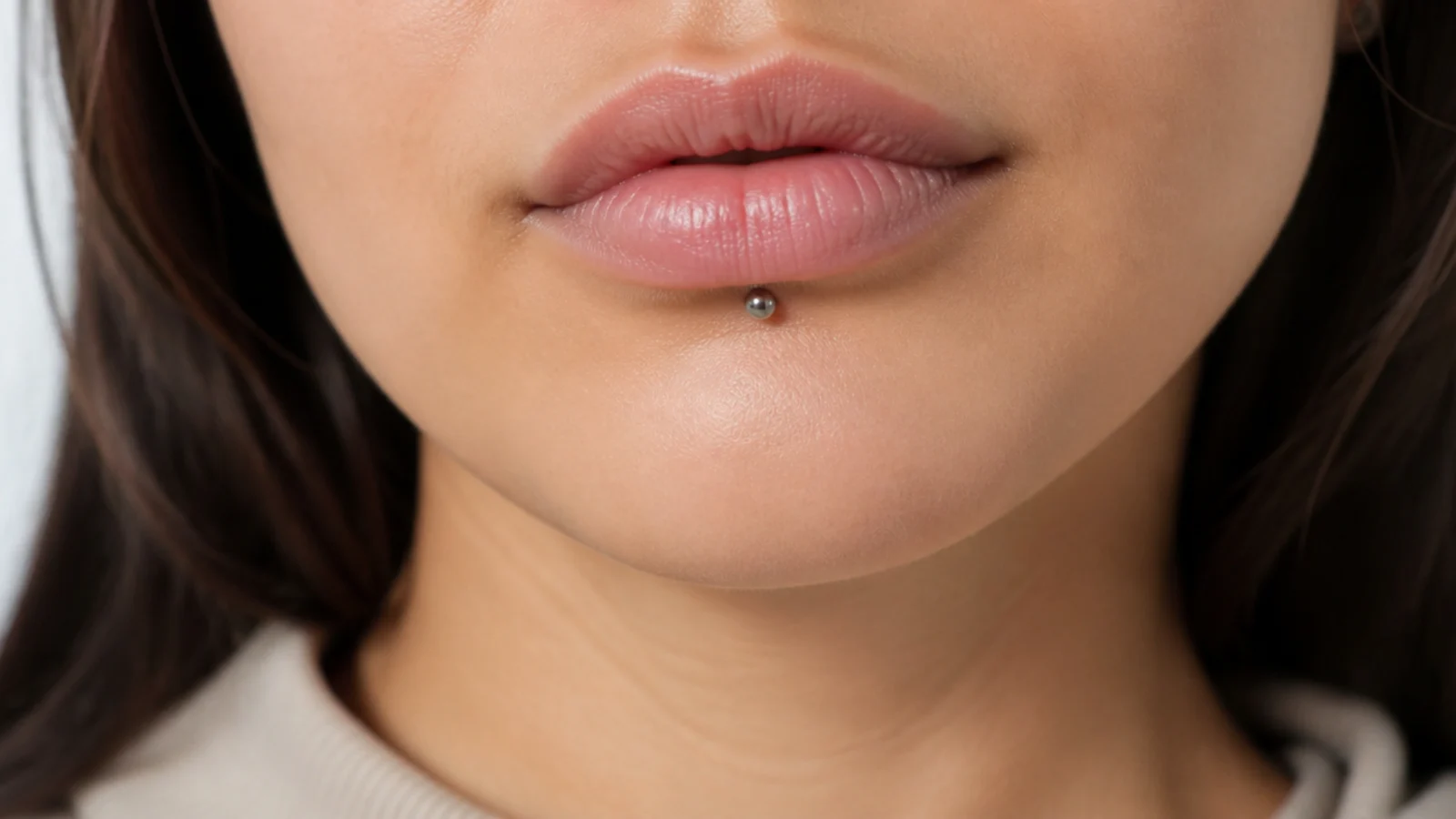 Hands away from a healing lip piercing