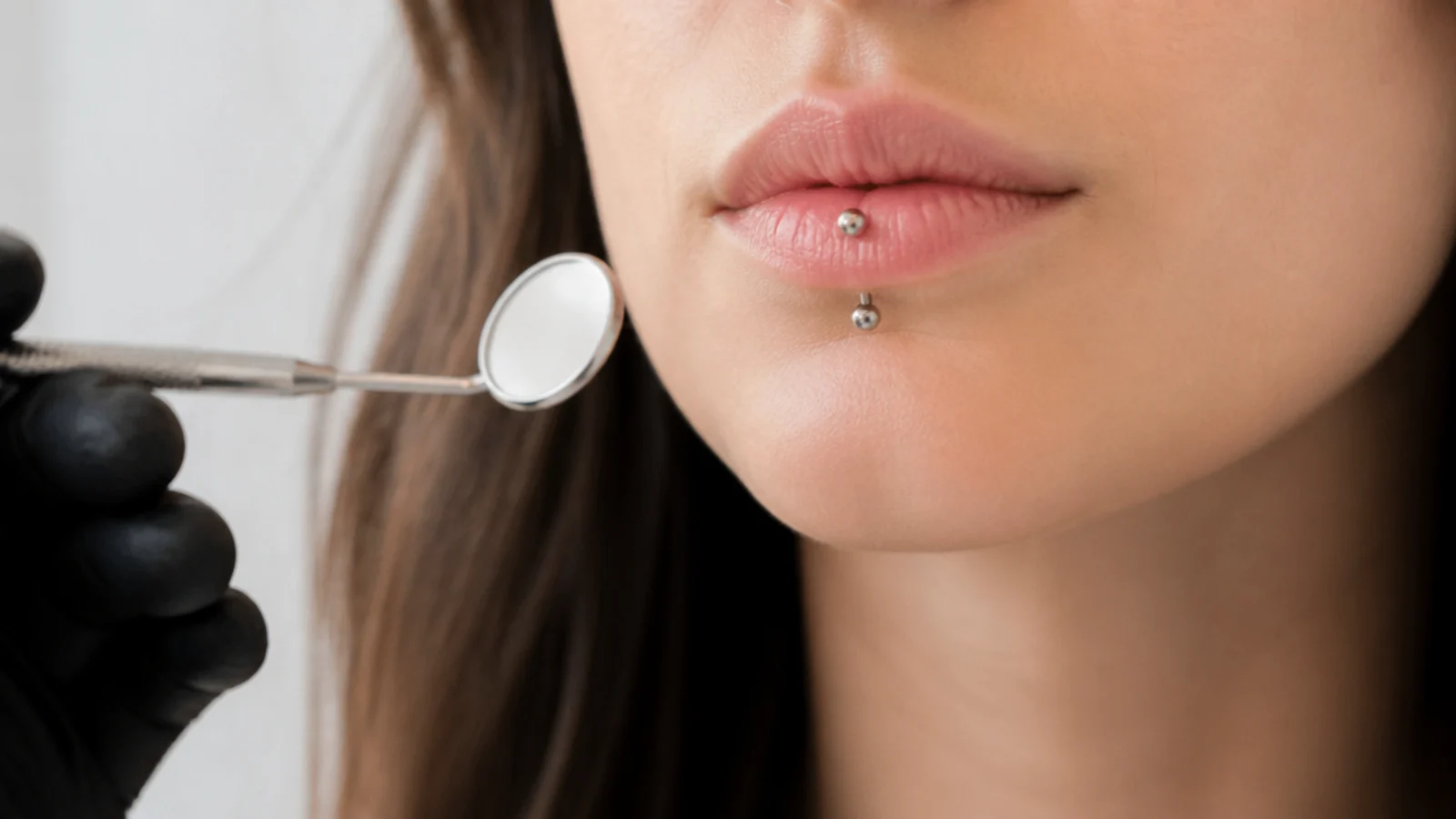 A dental check for lip-piercing wearers