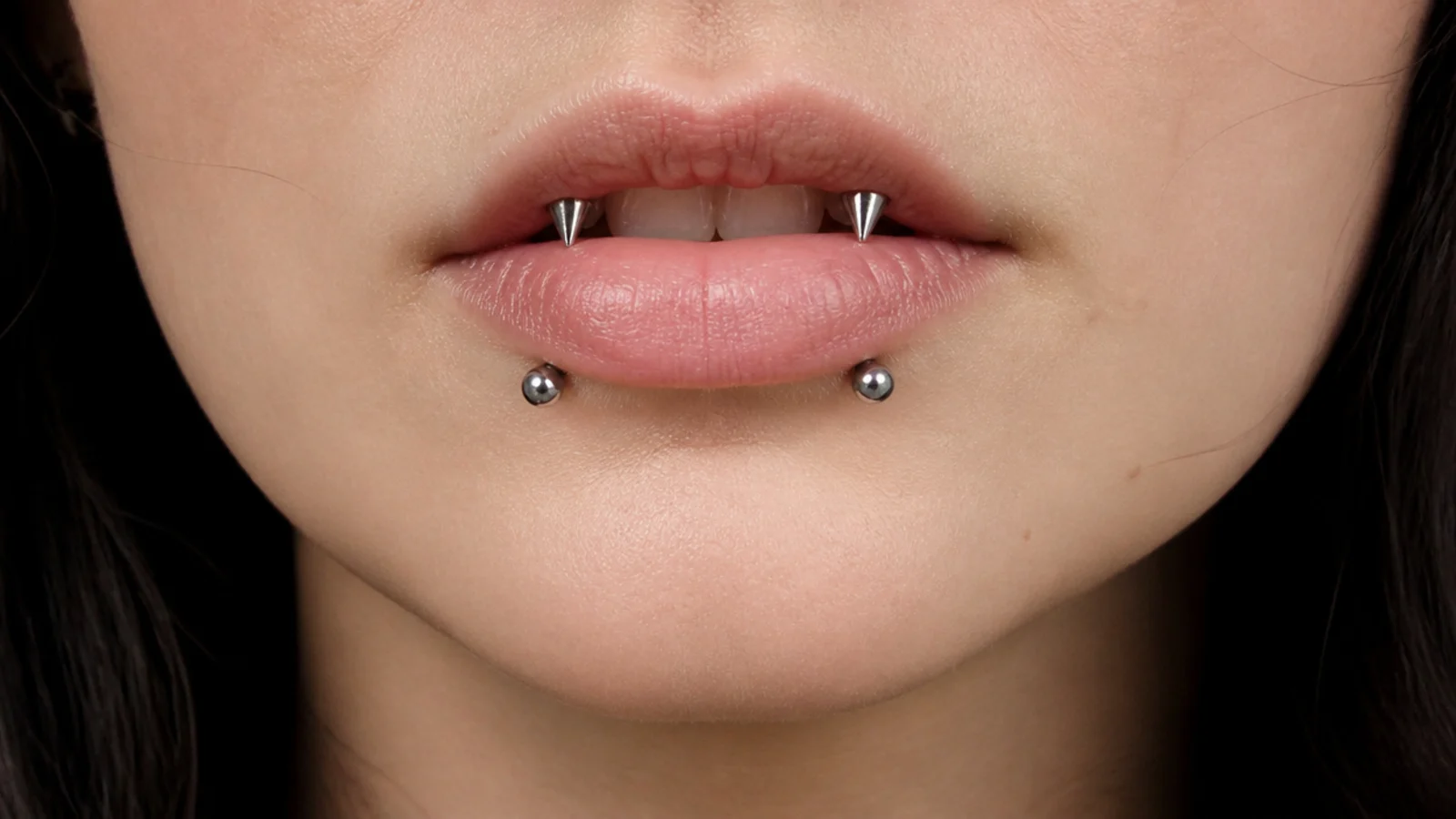 Angel fangs and snake bites as part of a curated lip