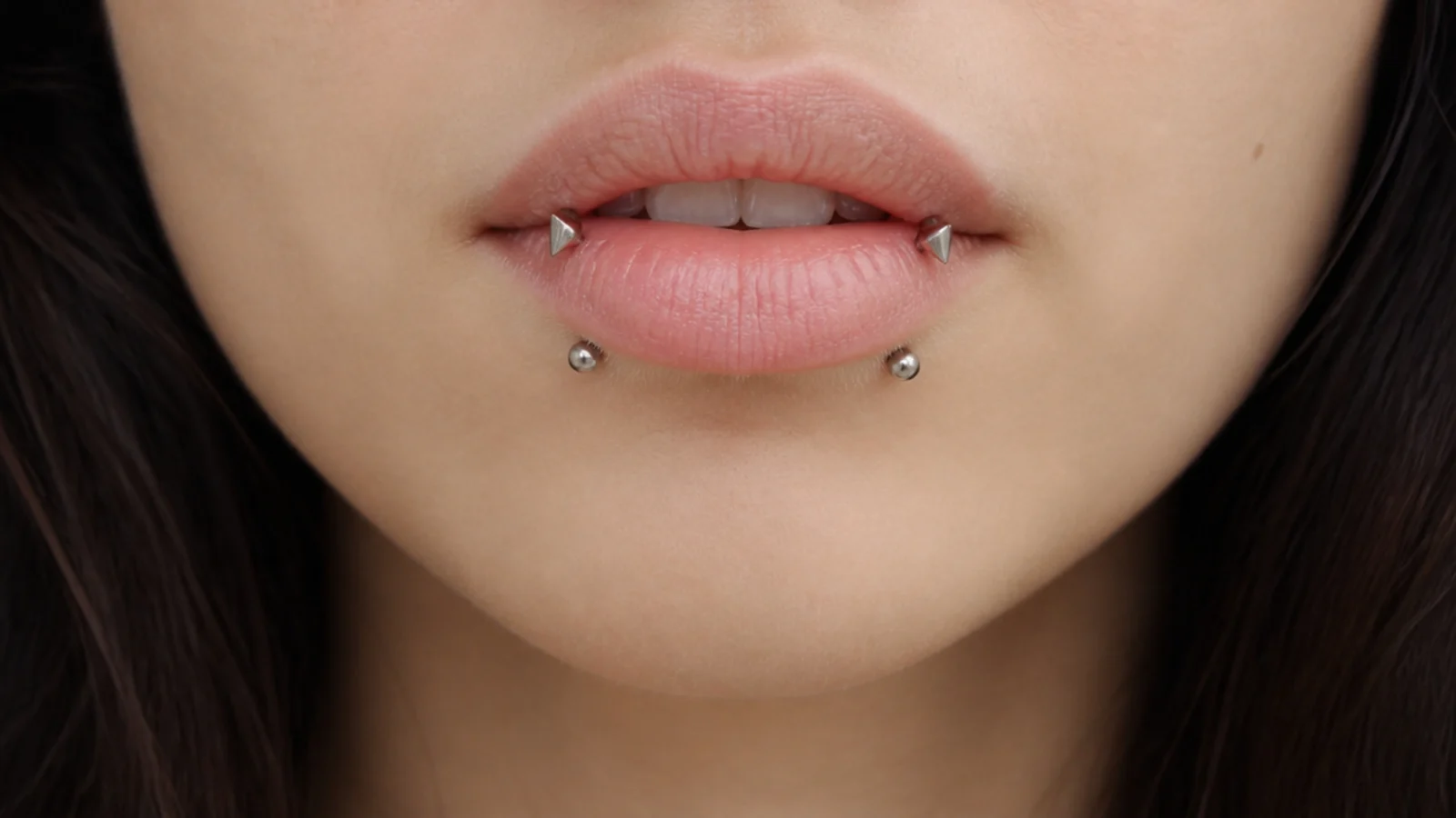 Angel fangs combined with snake bites for a layered lip look