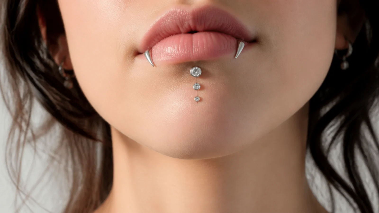 Angel fangs and vertical labret with graduated gem sizes