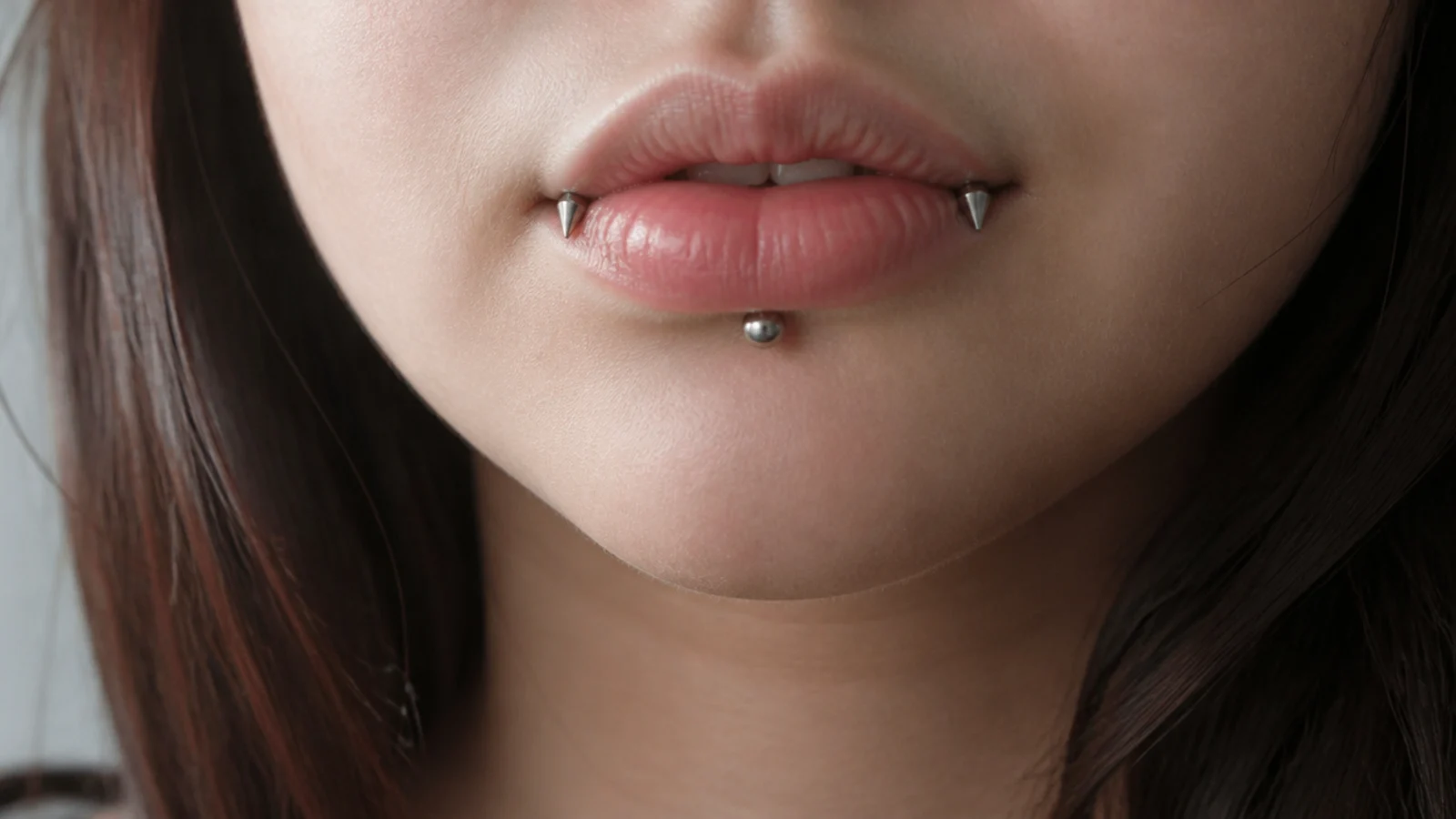 Angel fangs and vertical labret as part of a full curated lip