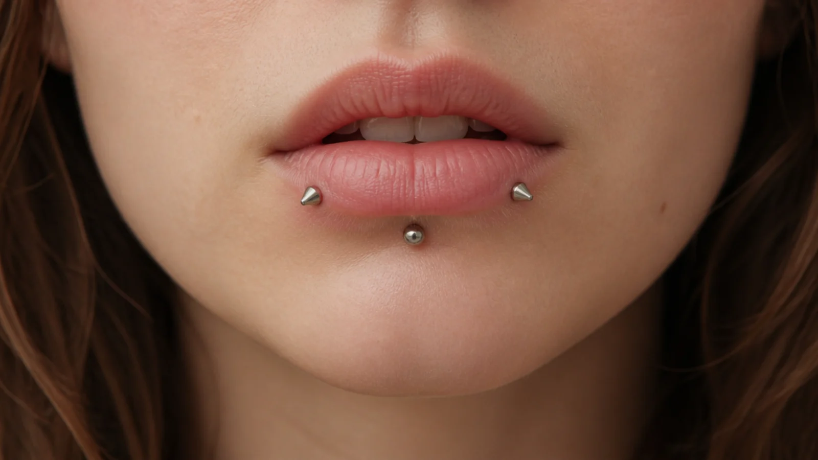 Angel fangs framing a central vertical labret