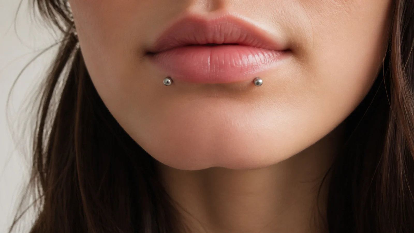 Snake bites placement set closer on the lower lip