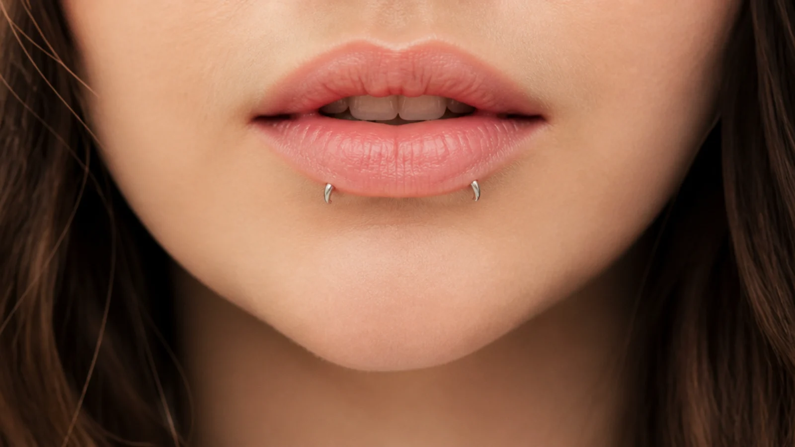 A subtle, close-set inverted angel fangs placement
