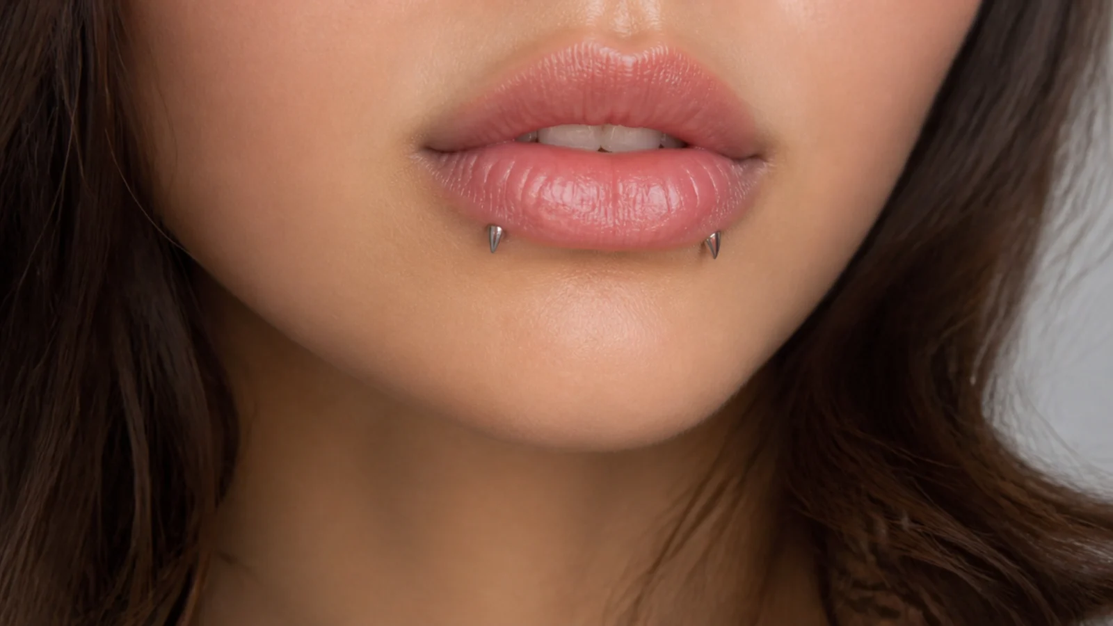 Reverse angel fangs as part of a curated lip look