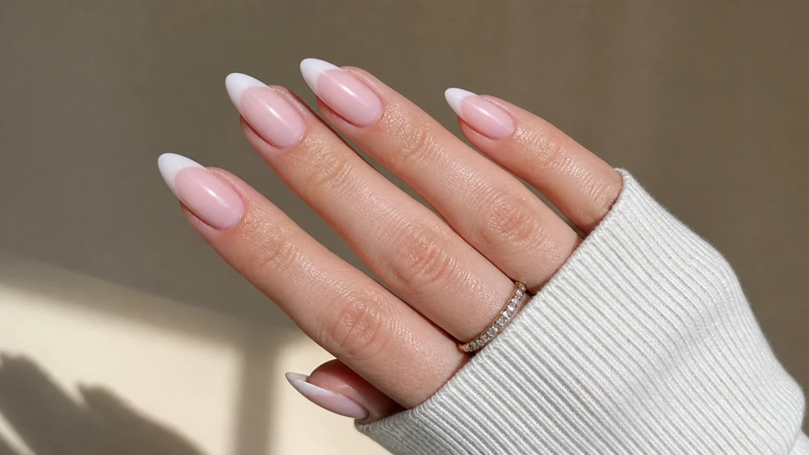 Almond baby boomer nails with a chrome finish