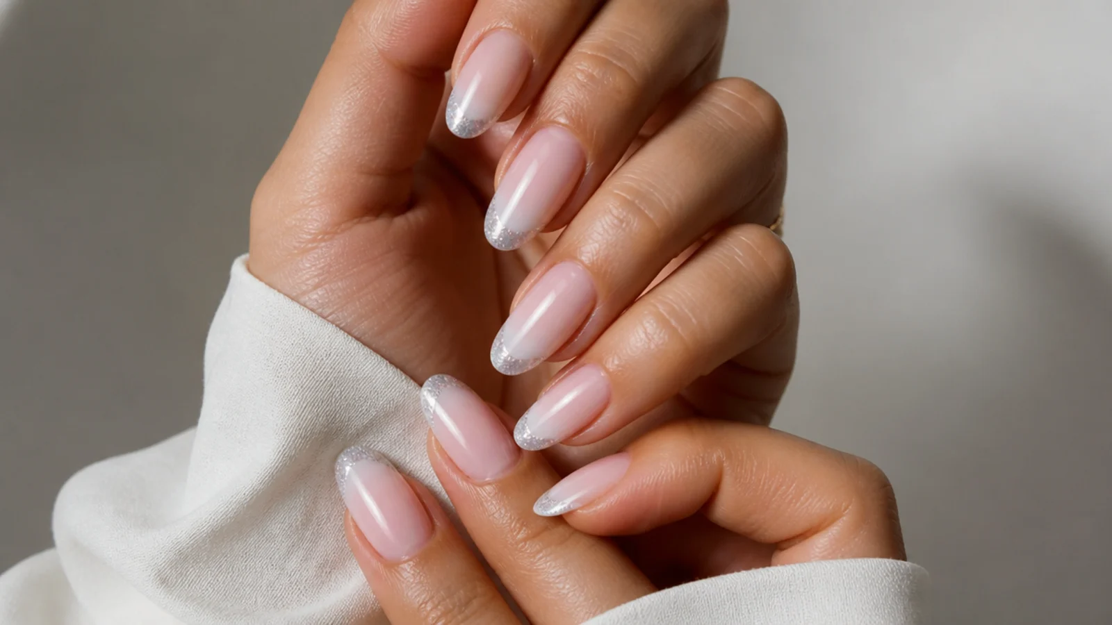 Almond baby boomer nails with a glitter tip