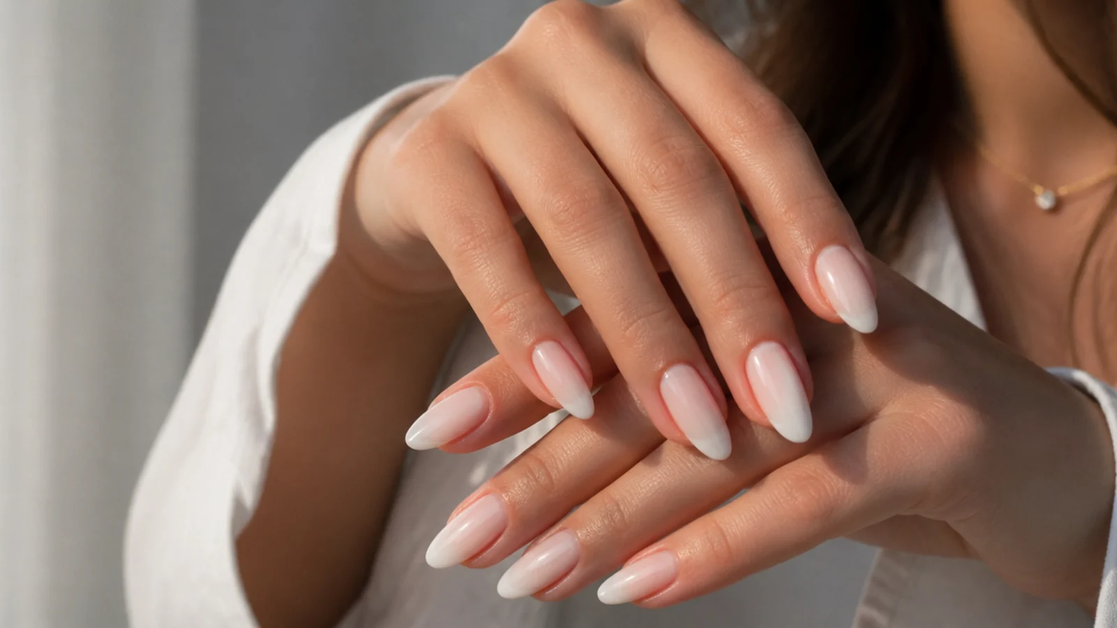 Almond baby boomer nails with a micro-French line