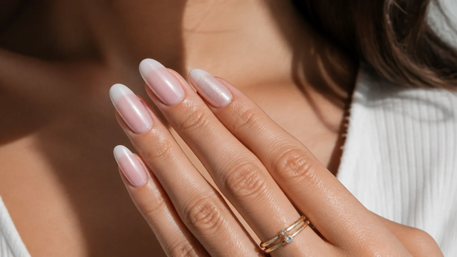 Almond baby boomer nails with a cat-eye accent