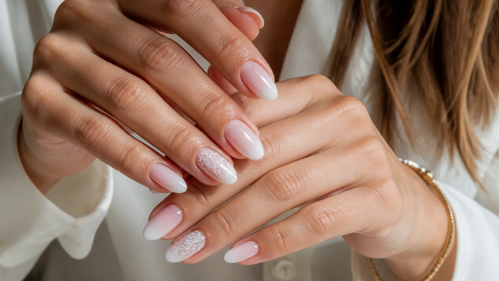 Almond baby boomer nails with a lace accent