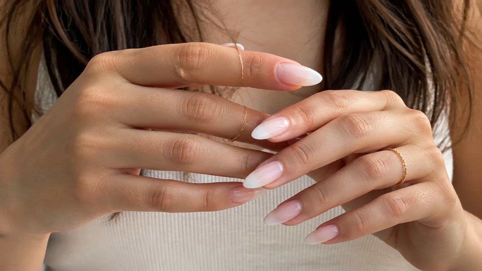 Almond baby boomer nails lengthening the fingers