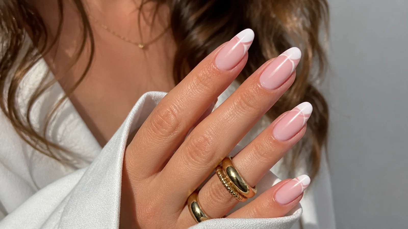 Baby boomer nails with a thin double-line French detail