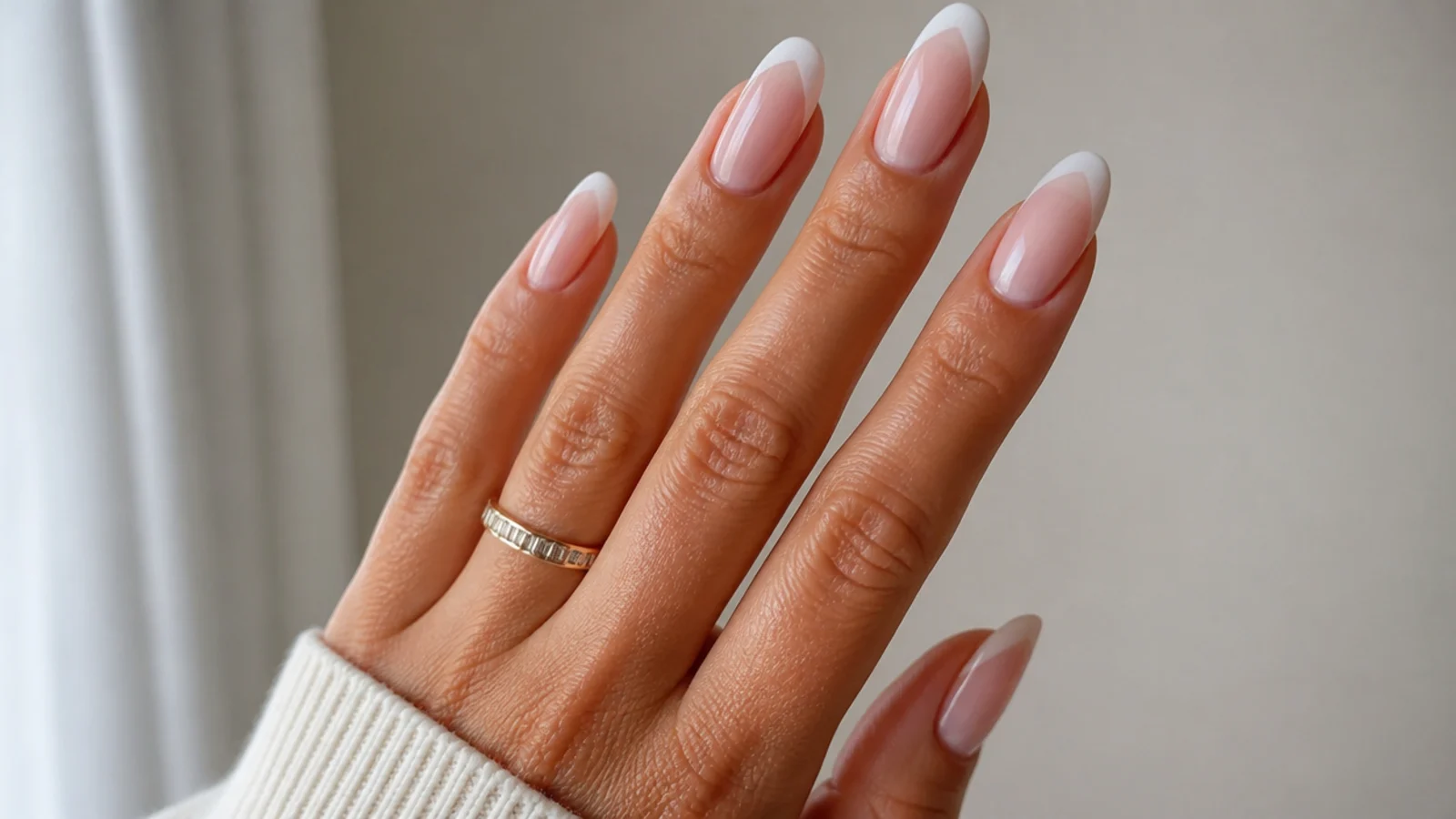 Baby boomer nails with a V-shaped French detail
