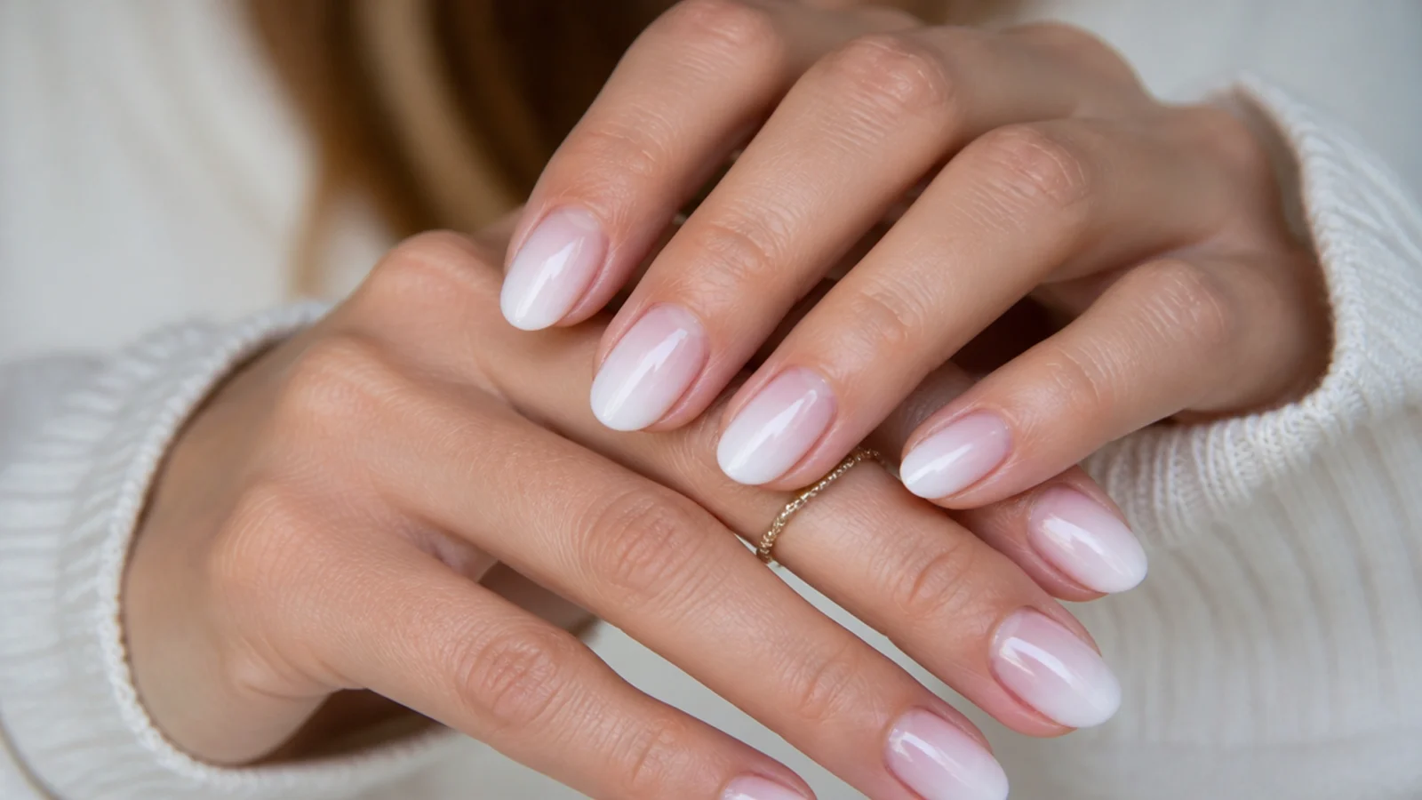 Baby boomer nails with a reverse French at the cuticle