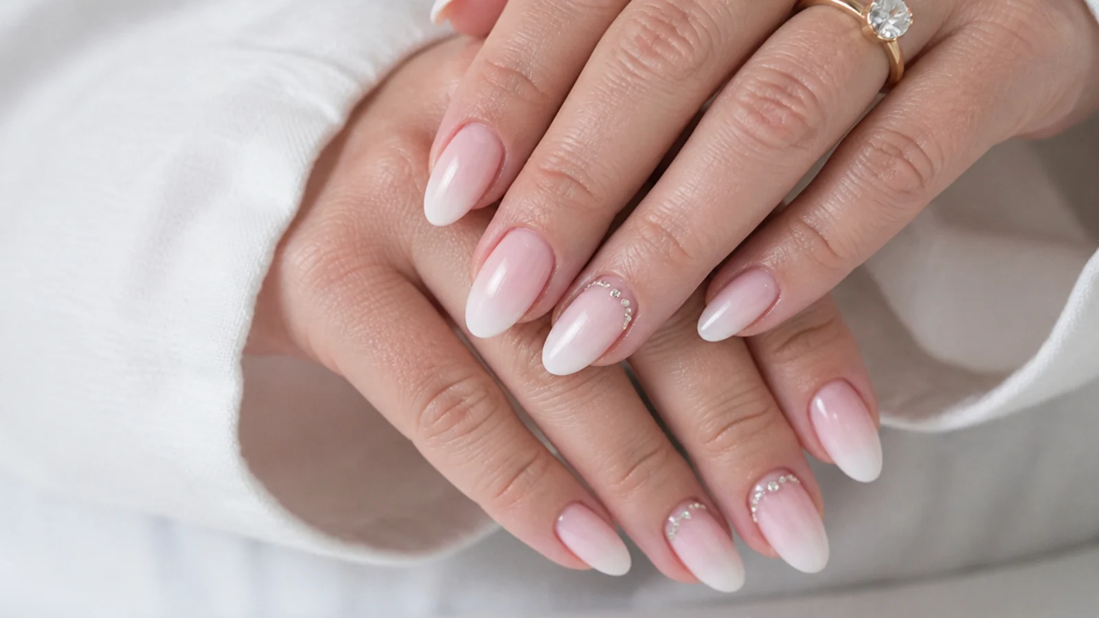 Baby boomer nails with delicate rhinestone accents