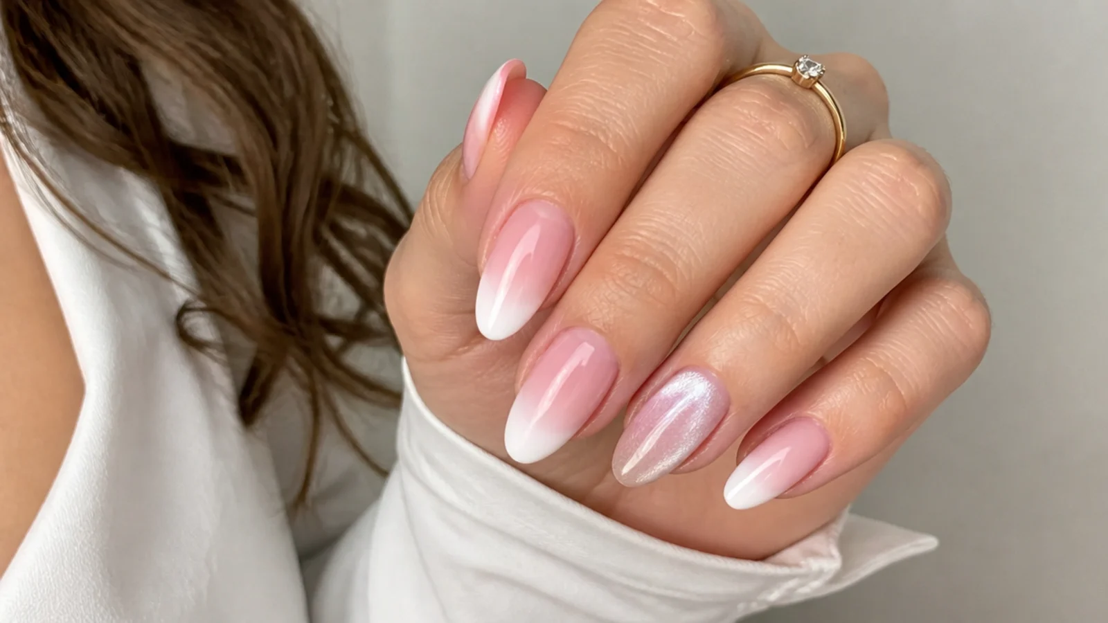 Baby boomer nails with a cat-eye accent nail