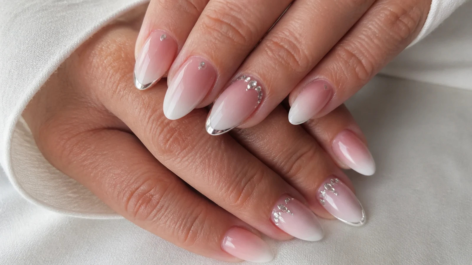 Baby boomer nails with chrome and rhinestone glam detail