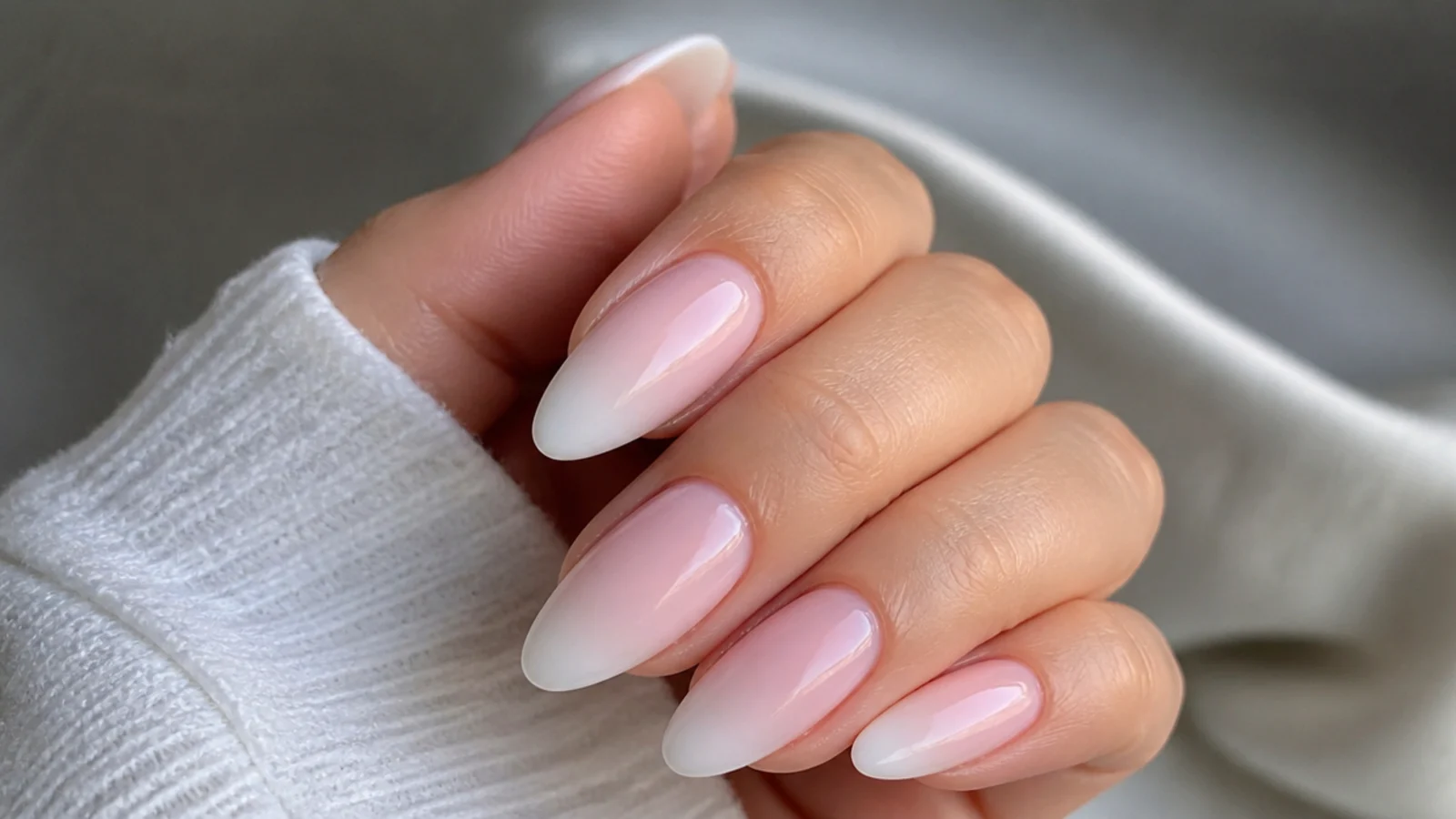 Close-up of a seamless pink-to-white baby boomer gradient