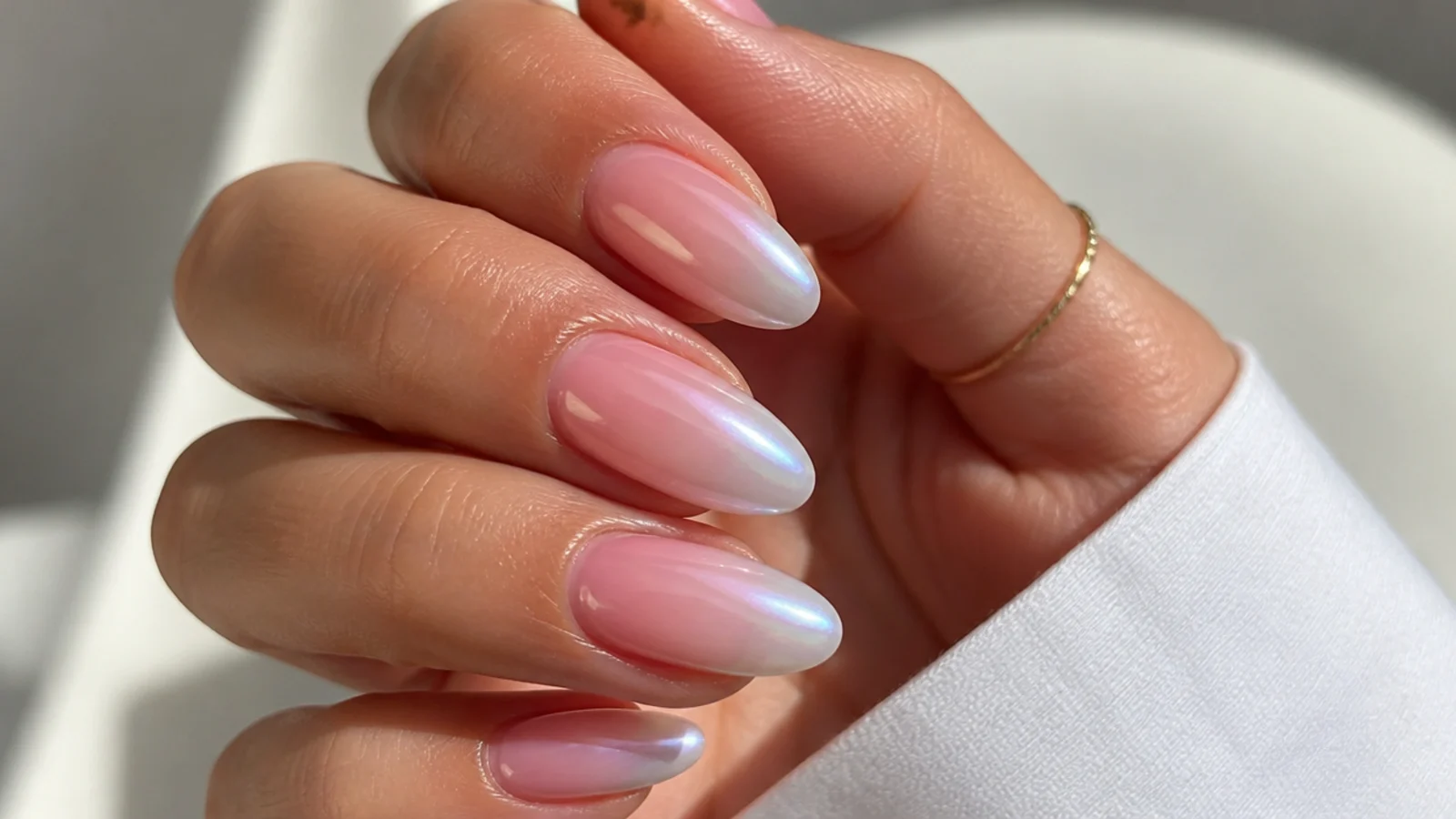 Baby boomer nails with an aurora chrome finish