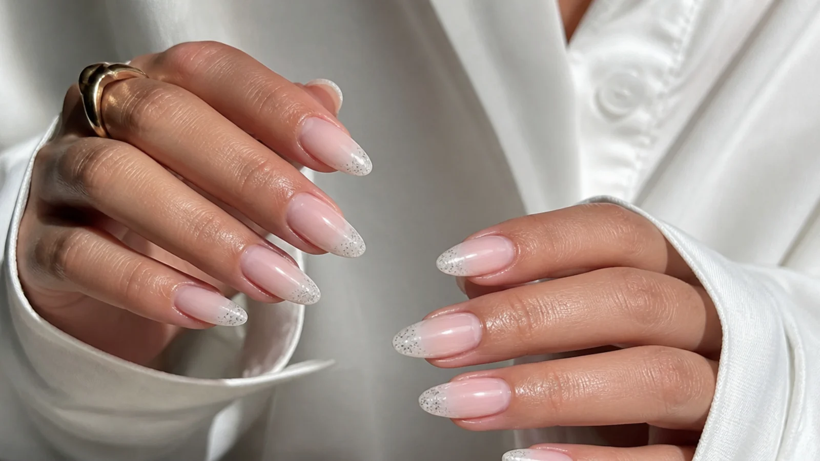 Almond baby boomer nails with a glitter tip