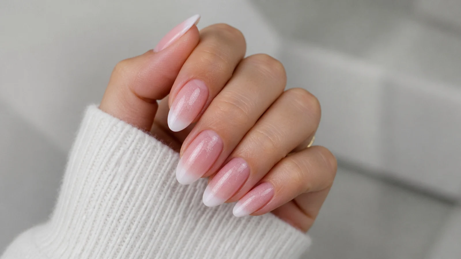 Baby boomer nails with glitter in the pink base