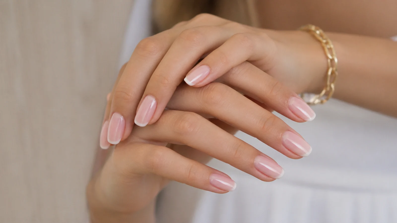 Pink baby boomer nails with a thin French line