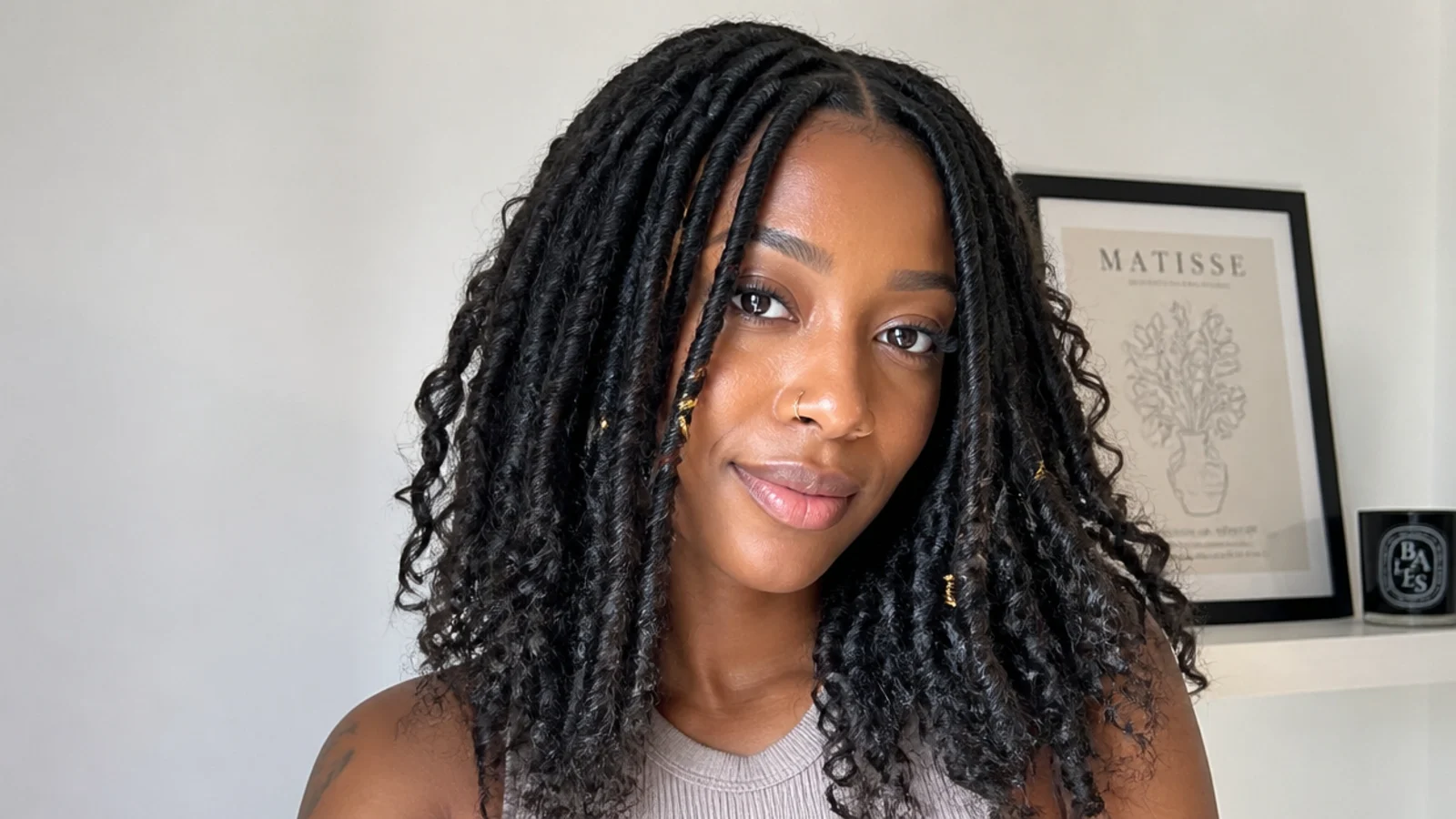 Soft, natural frizz on lived-in butterfly locs