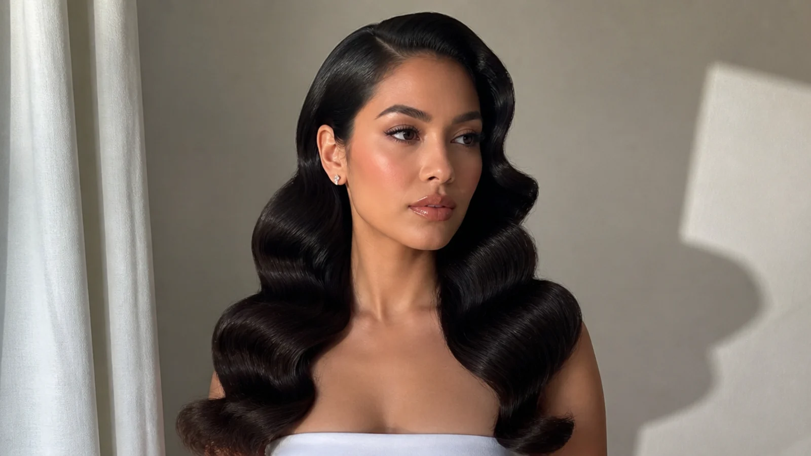 High-shine Hollywood waves on dark hair