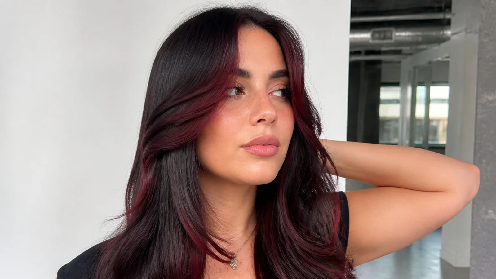 Dark hair with a deep burgundy money piece