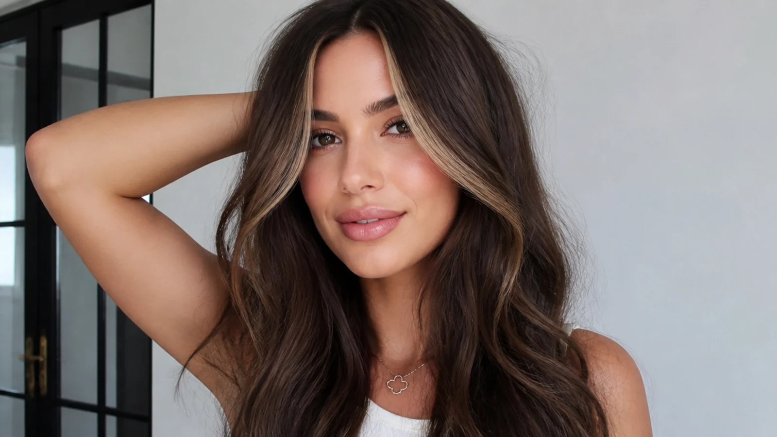 Brown hair with a subtle glossed money piece for shine