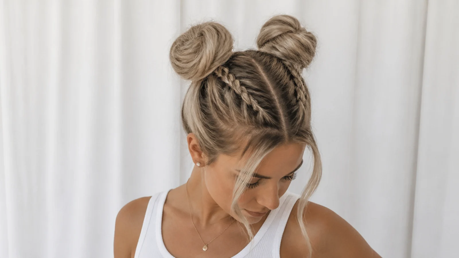 French braids leading up into space buns