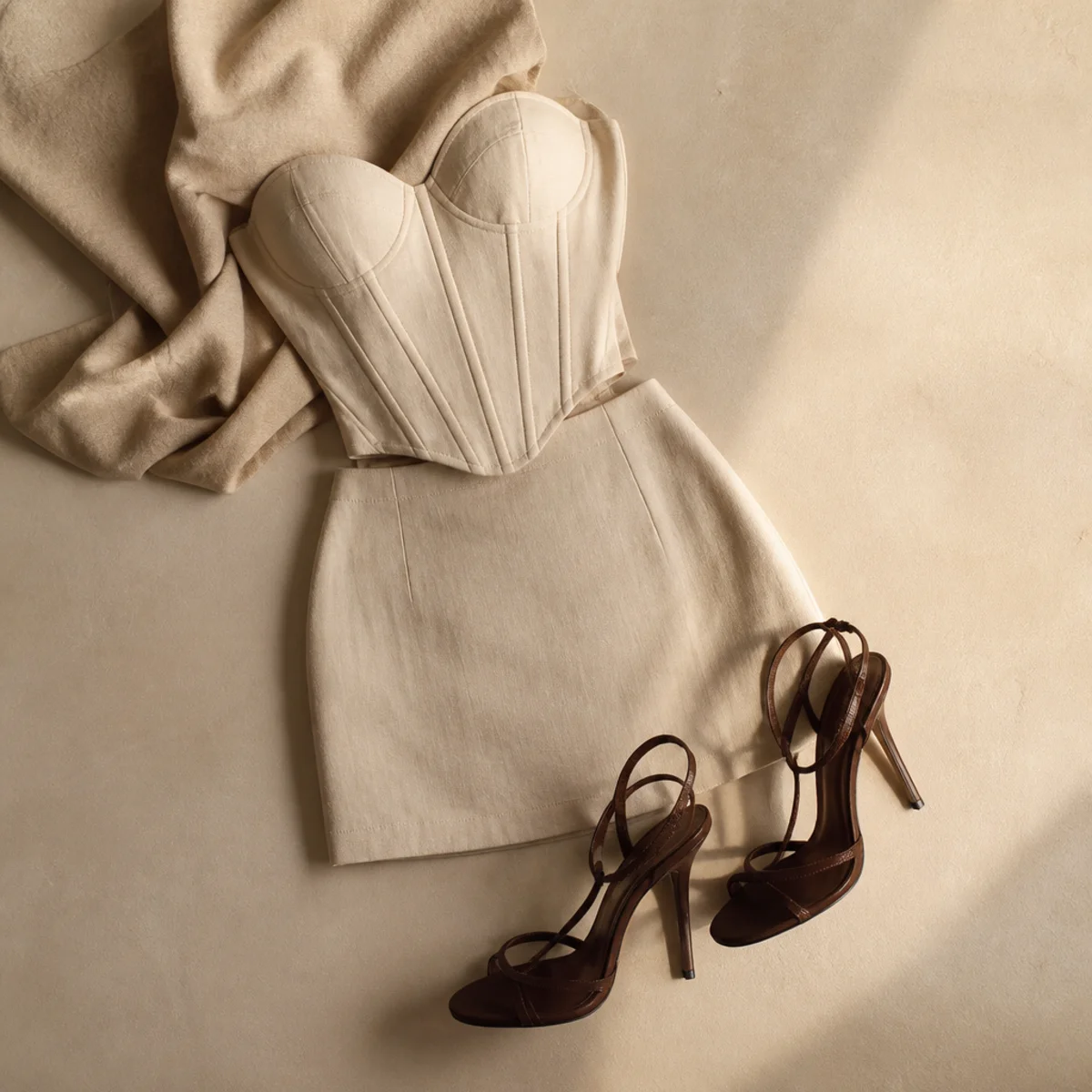 Faceless full-length shot of a corset top with a mini skirt and heels for date night