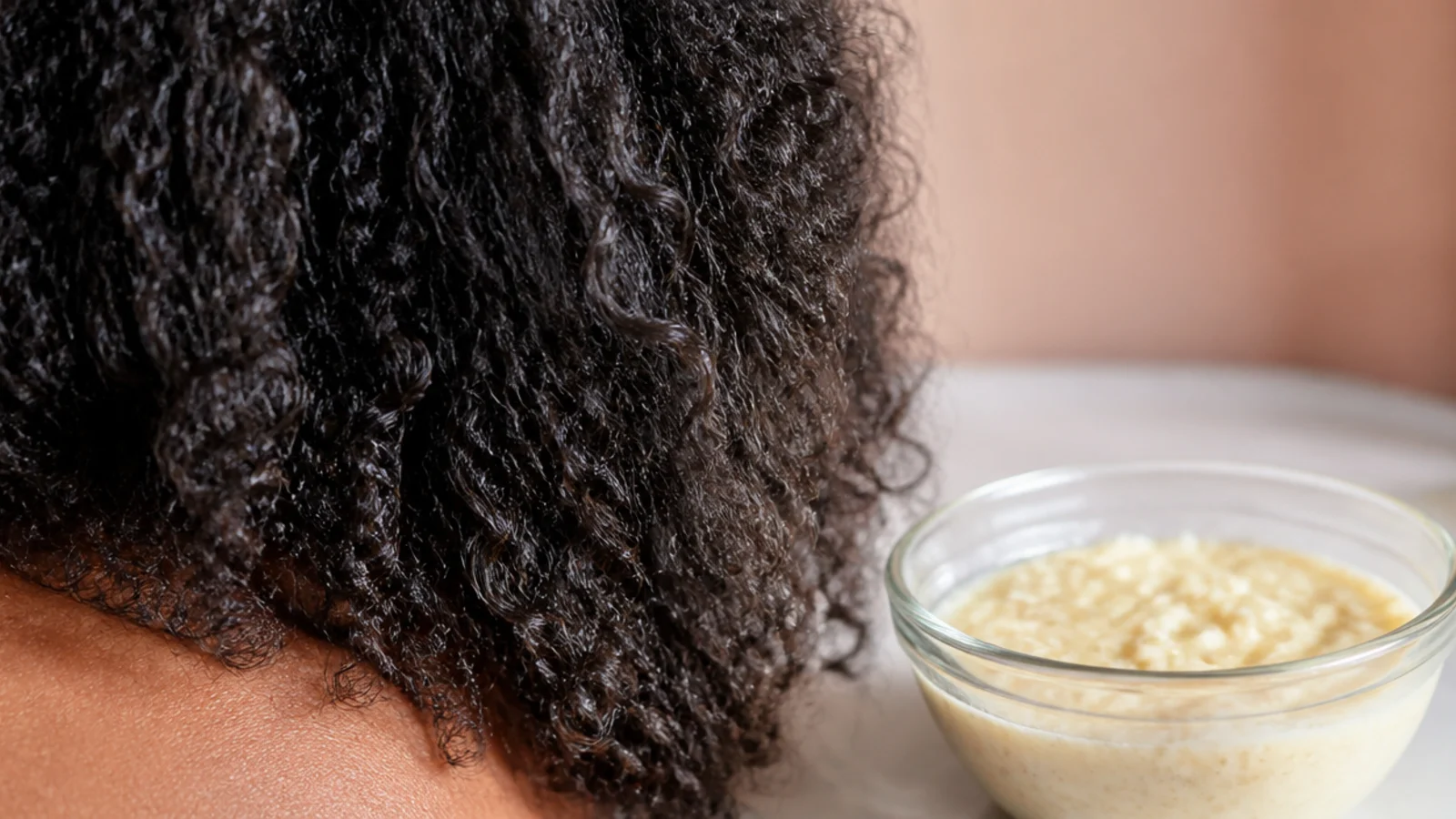 Blended banana and plain yogurt hair mask for coarse frizzy hair in a glass bowl