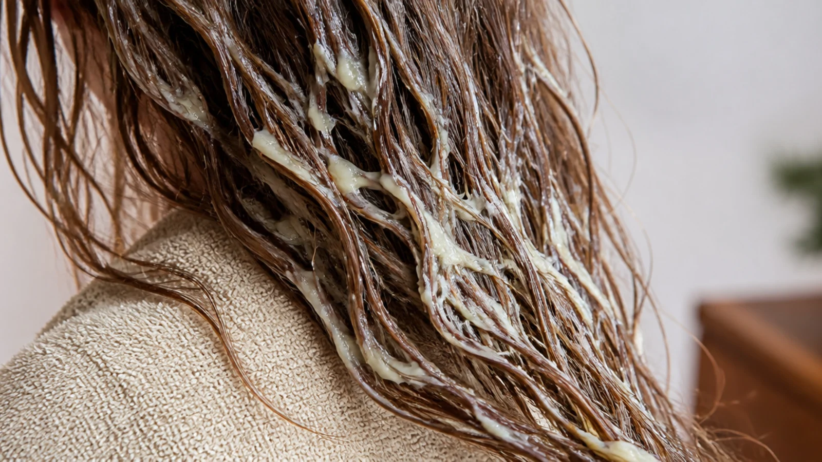 Full fat mayonnaise applied to the damaged frizzy ends of long hair as an intensive mask