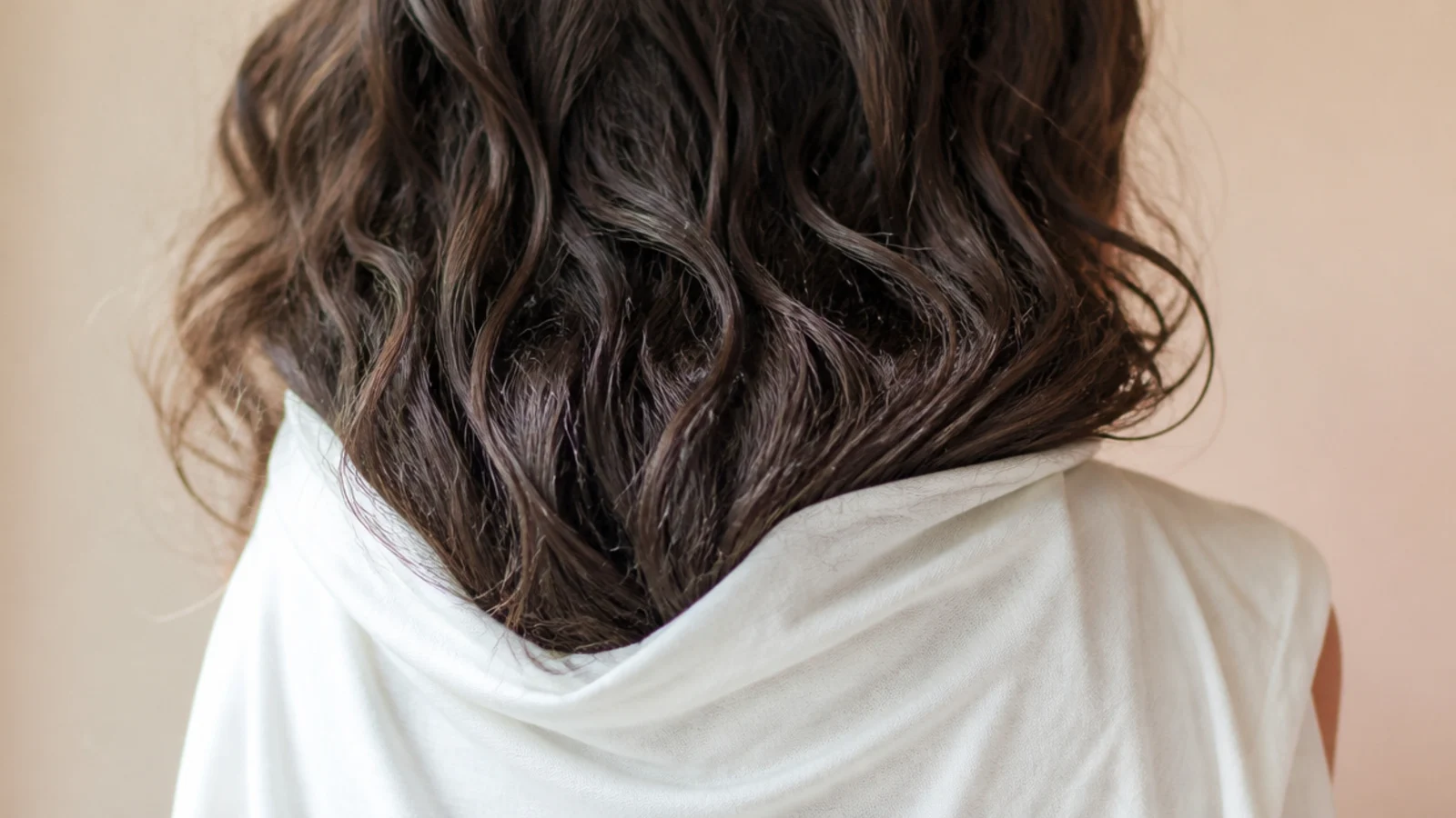 Wavy frizzy hair plopped into a cotton t-shirt instead of a terry towel to reduce frizz