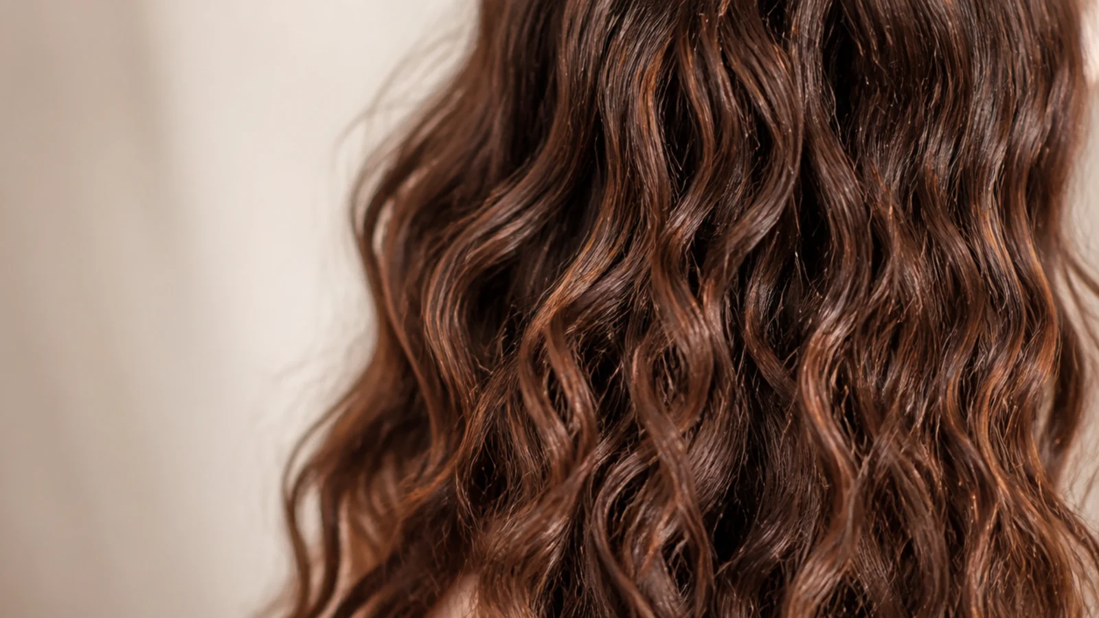 Overnight braid waves on thick frizzy hair shown unbraided into soft uniform S waves with no frizz halo