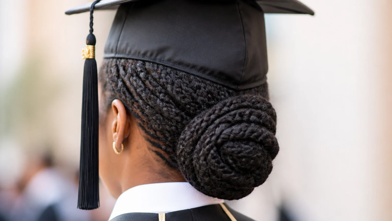 Flat twists graduation hairstyle with cap leading into a low bun on 4C natural hair