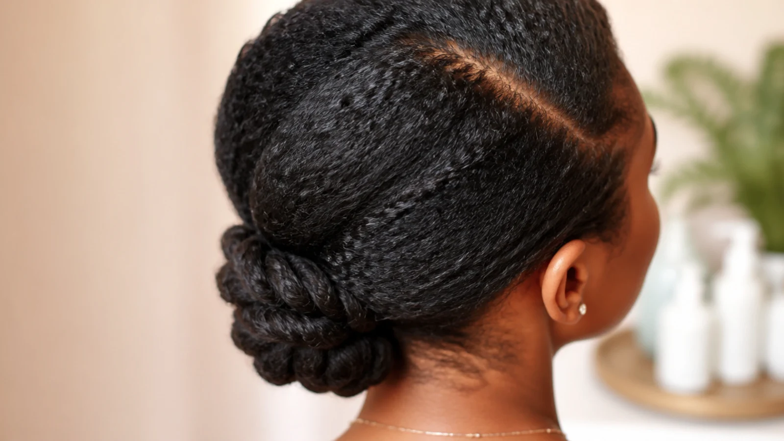 Loose low braid tucked at the ends as a protective style for hair growth