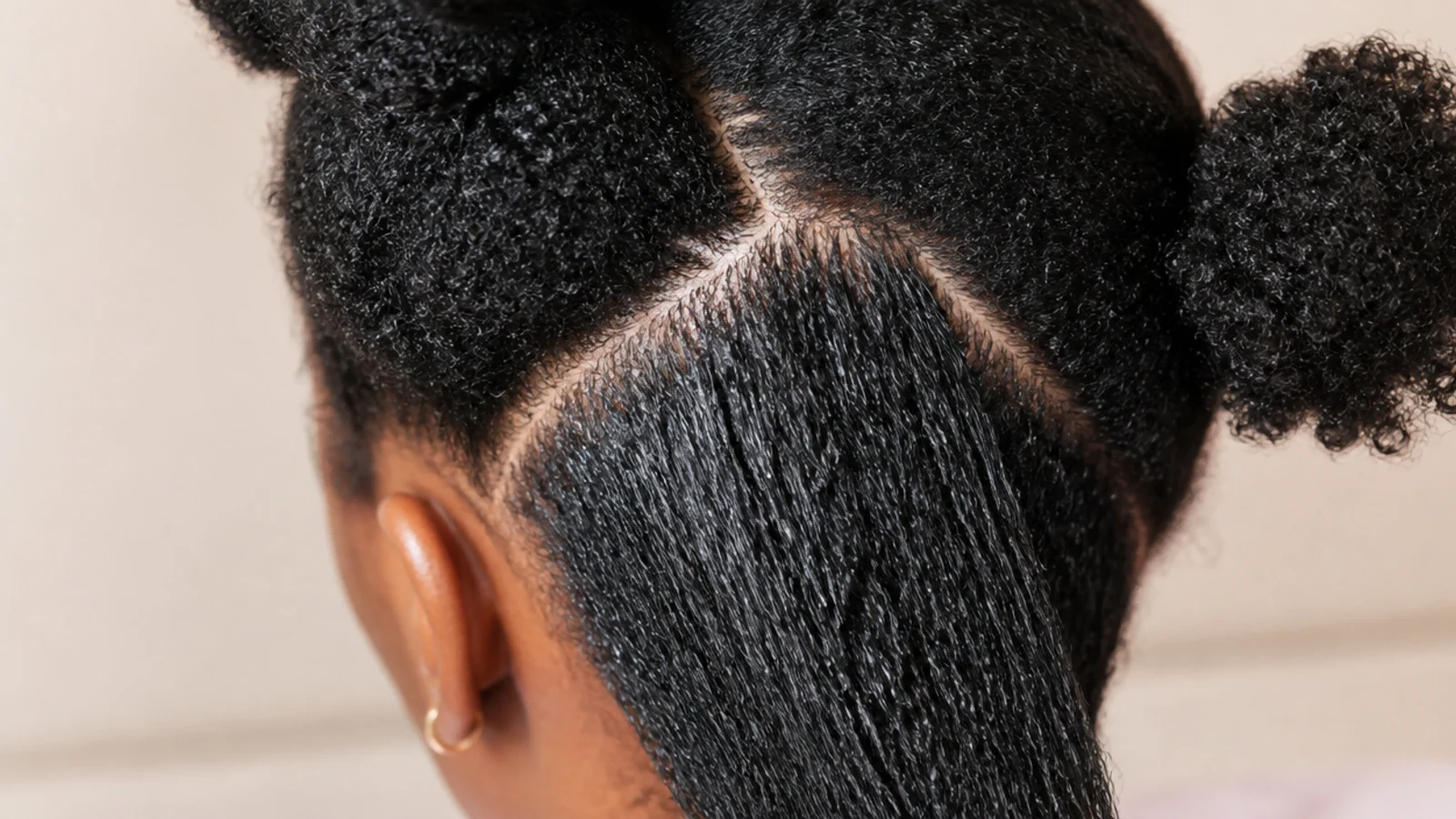 Leave in conditioner oil and cream applied in order to damp sectioned 4C hair to seal moisture