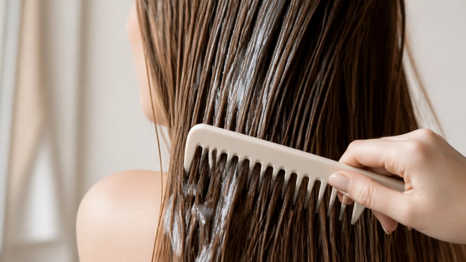 Wide tooth comb detangling conditioner coated hair from the ends upward to prevent breakage