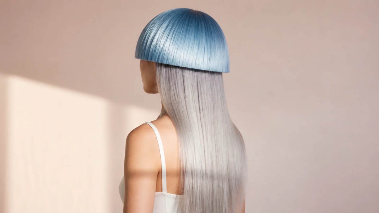 Futuristic jellyfish haircut with a chrome blue rounded bell over long straight silver hair