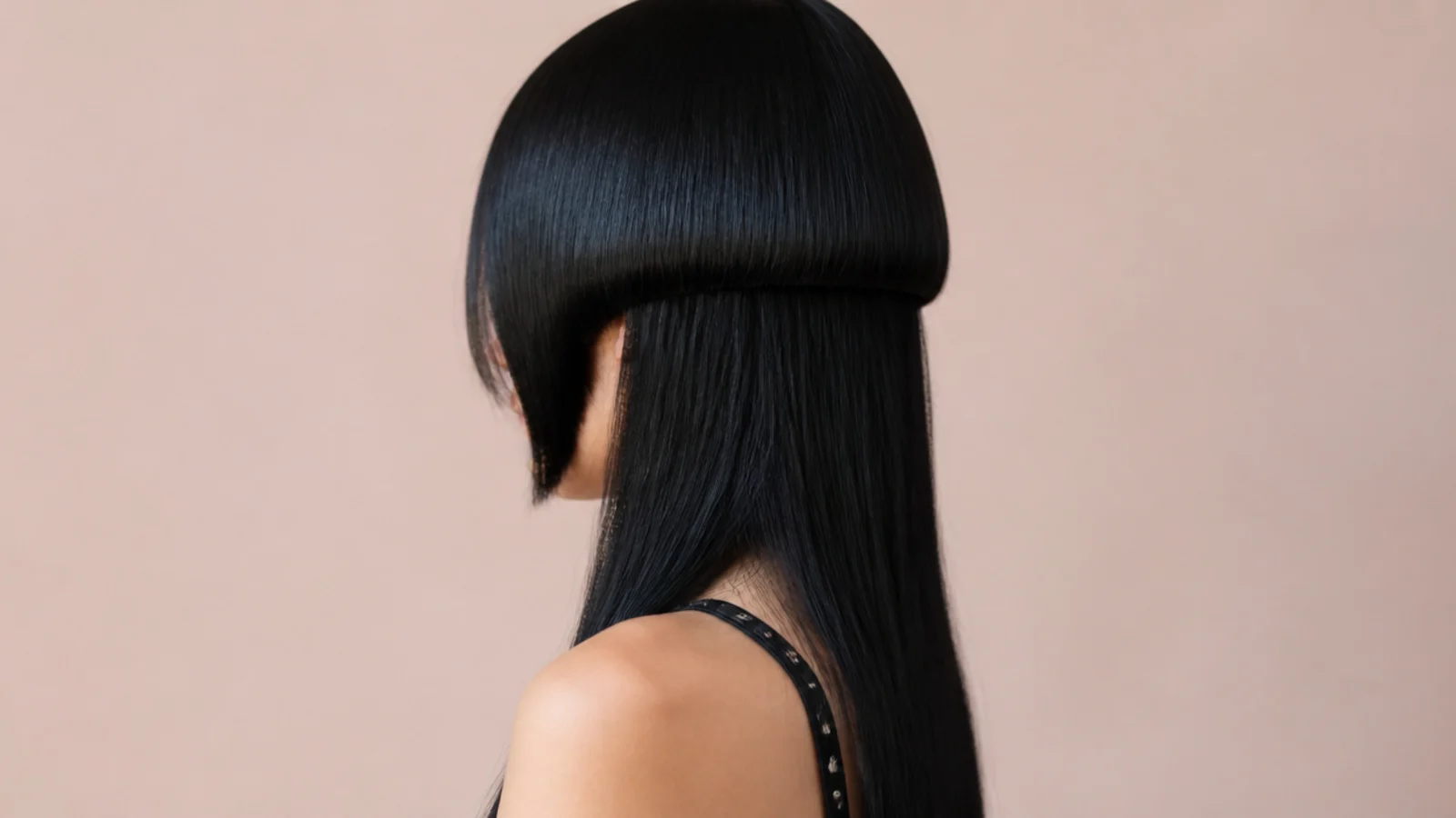 Soft goth jellyfish haircut with a rounded blue black bell and long straight blue black lengths